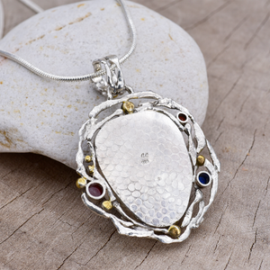 Fused dichroic glass pendant in a handmade setting of sterling silver accented with 18K gold plating. (N873)