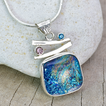 Load image into Gallery viewer, Fused dichroic glass pendant in a handmade setting of sterling silver accented with sparkly cubic zirconias. (N874)
