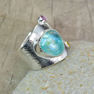 Artisan ring with a fused glass cabochon in a hand crafted setting of tarnish resistant sterling silver. (R895)